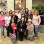 Group of women smiling in living room