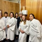Group of people in white choir robes